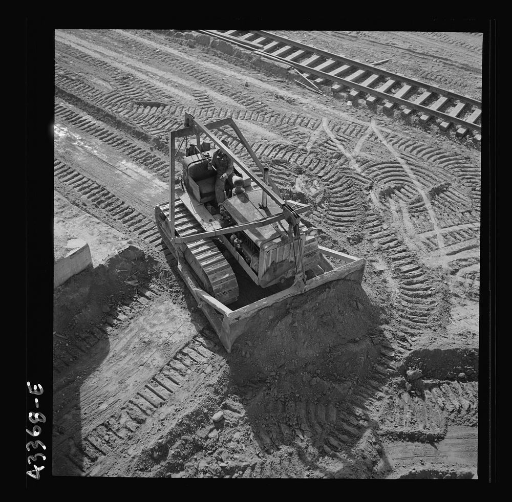 Columbia Steel Company in Geneva, Utah. Bulldozer used in grading during the construction of a new steel mill which will…