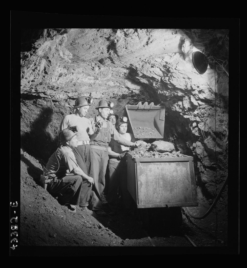 New Idria, California. Loading cinnabar, an ore containing mercury and sulphur, into a mine car with a mechanical loader.…