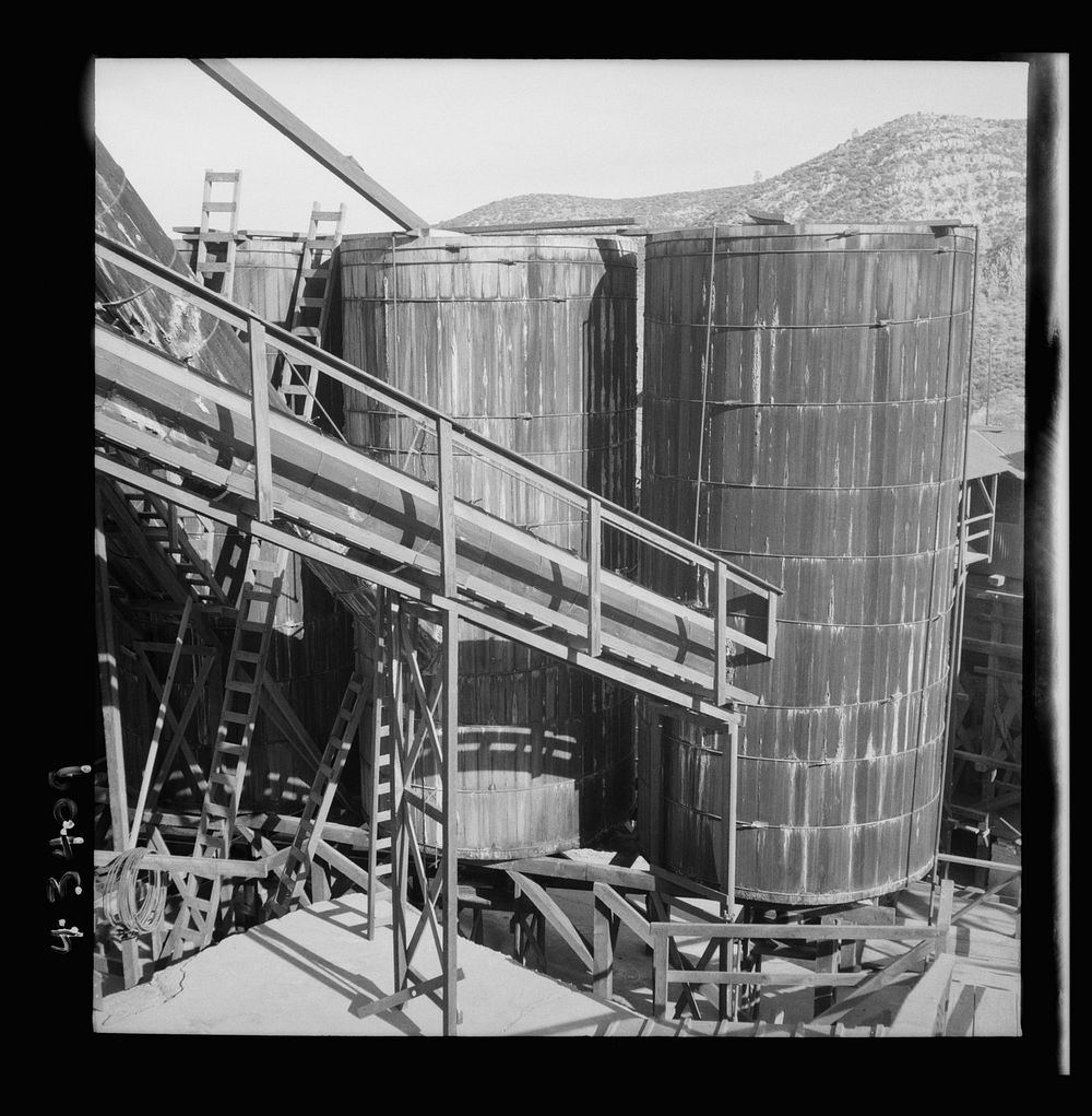 [Untitled photo, possibly related to: New Idria, California. Tanks at the mercury extraction plant of the Quicksilver Mining…