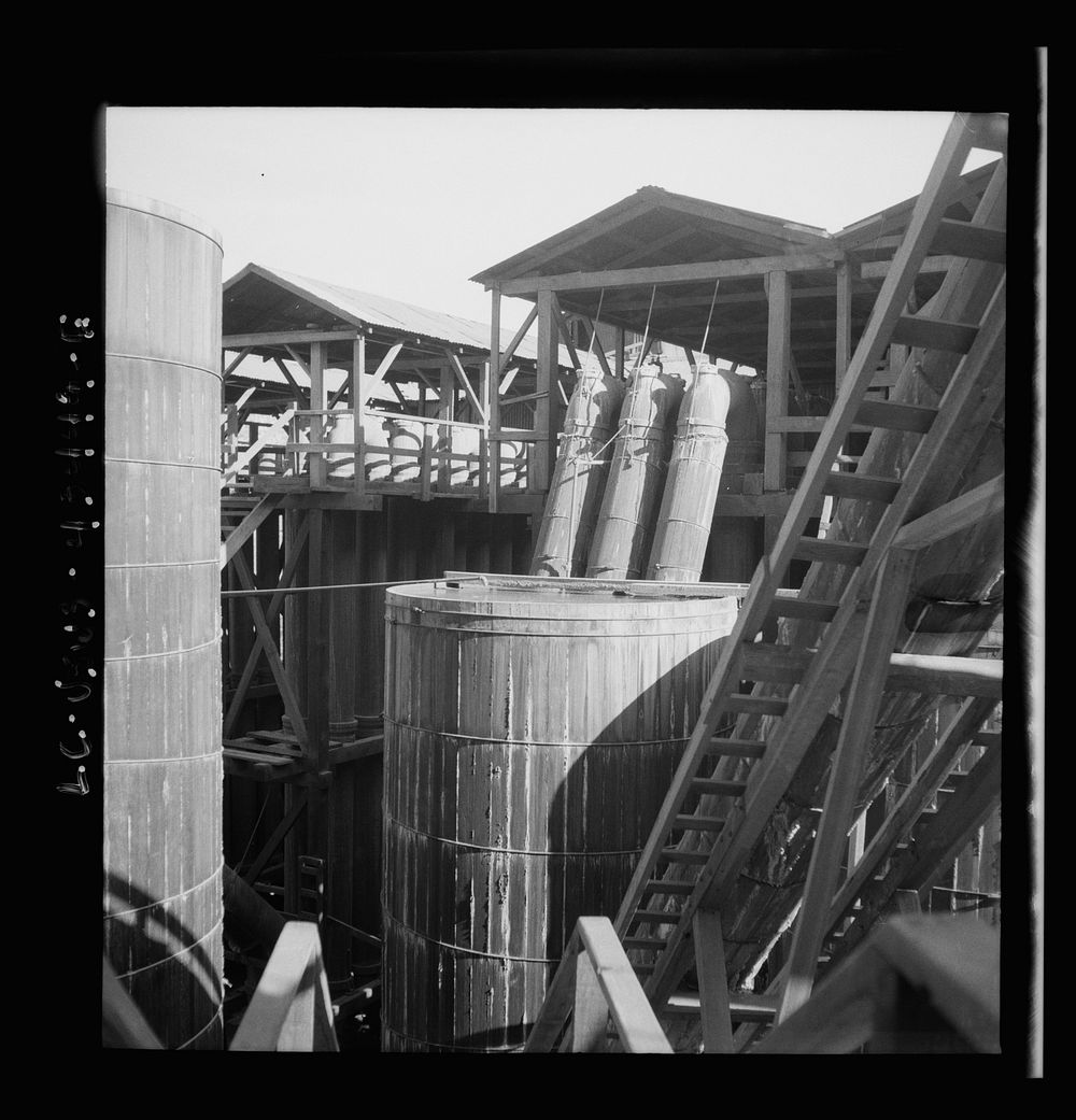 [Untitled photo, possibly related to: New Idria, California. Tanks at the mercury extraction plant of the Quicksilver Mining…