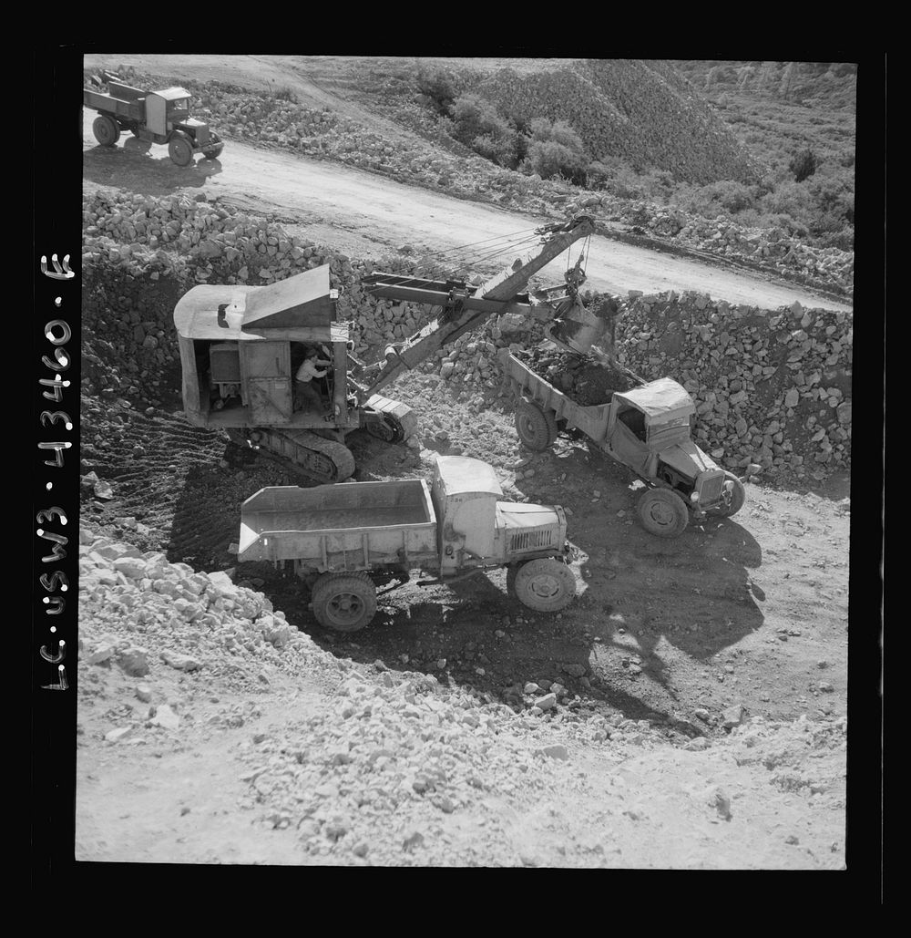 [Untitled photo, possibly related to: New Idria, California. Trucks, shovel, and crane used in loading cinnabar, an ore…