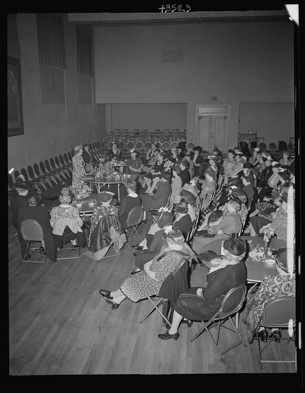 Brooklyn, New York. A woman speaker addressing the church women at the community house of the Church of the Good Shepherd.…