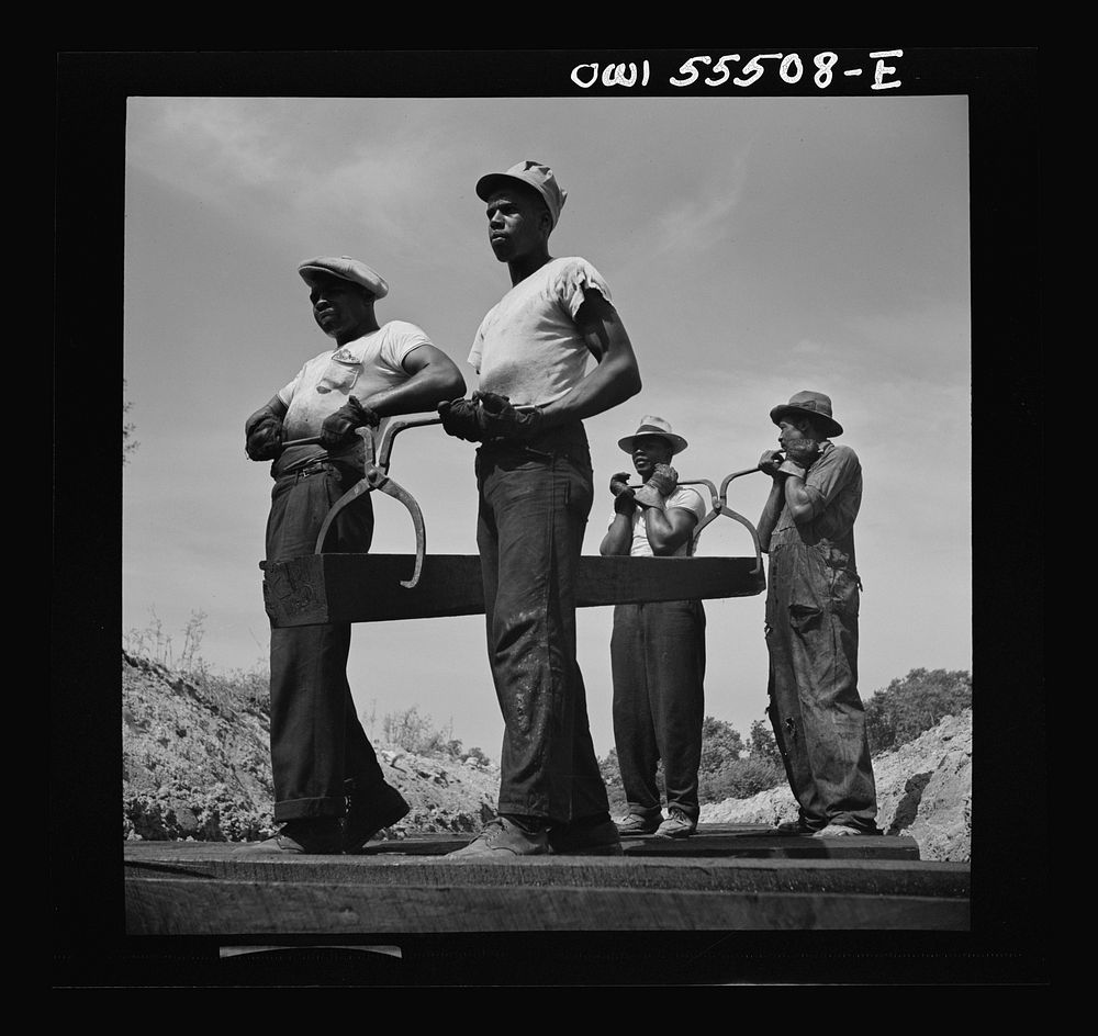 [Untitled photo, possibly related to:  laborers carrying and laying railroad ties for a spur line into a coal storage space…