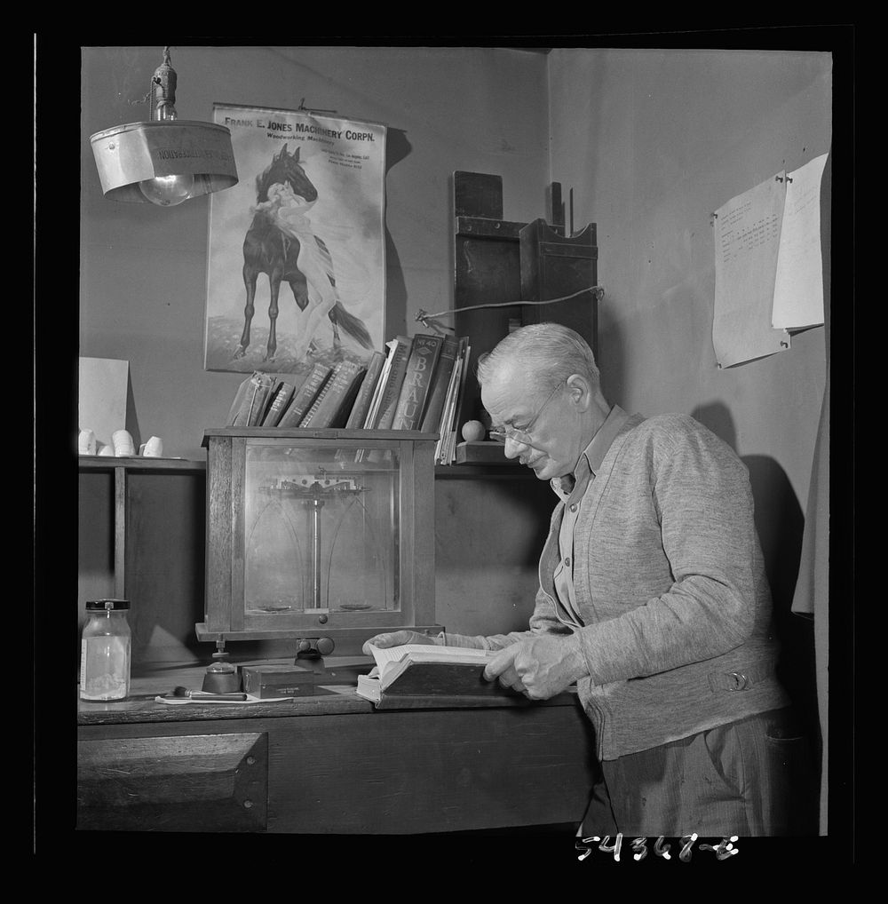 Kingman (vicinity), Arizona. Mr. Relling, in the laboratory, analyzing tungsten ore and concentrates in a plant near the…
