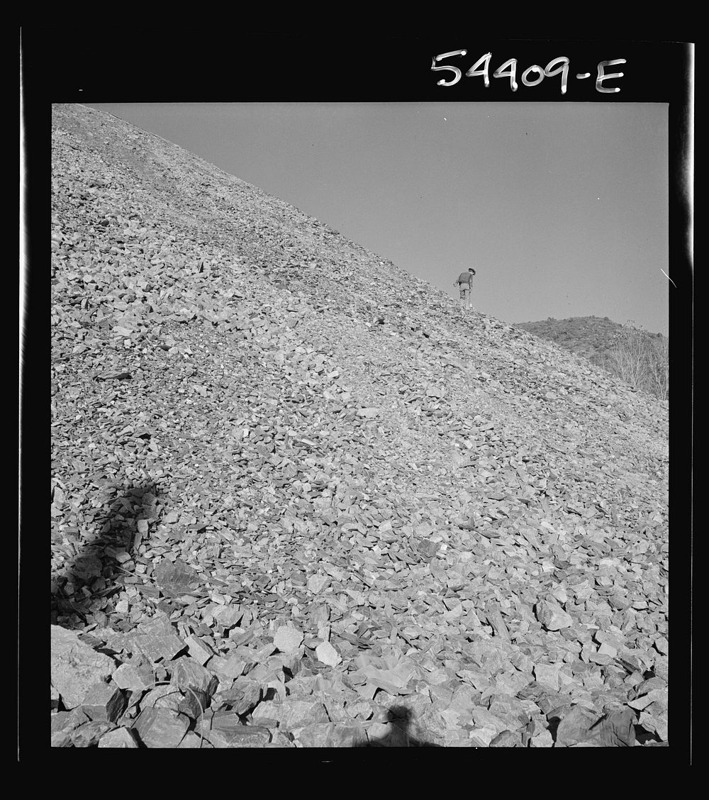 [Untitled photo, possibly related to: Kingman (vicinity), Arizona. A huge waste pile, showing a workman near the center…