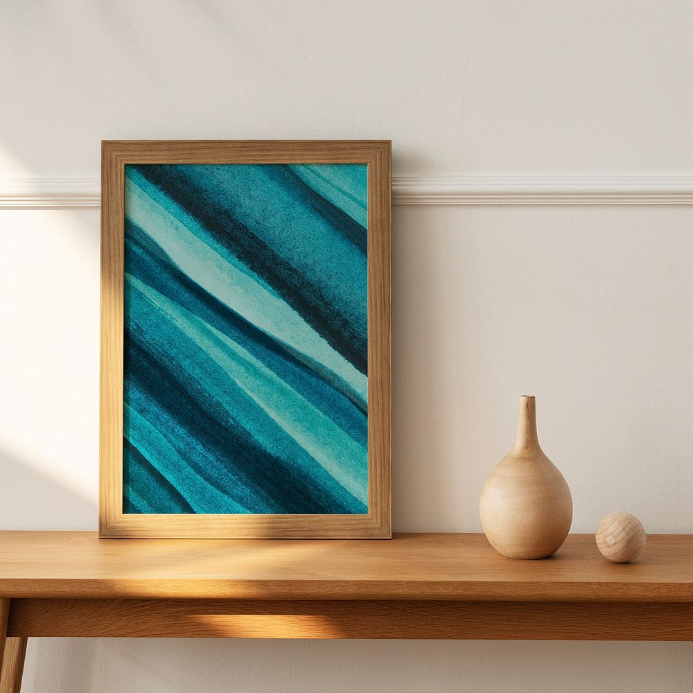 Ombre picture frame psd mockup on a wooden sideboard table