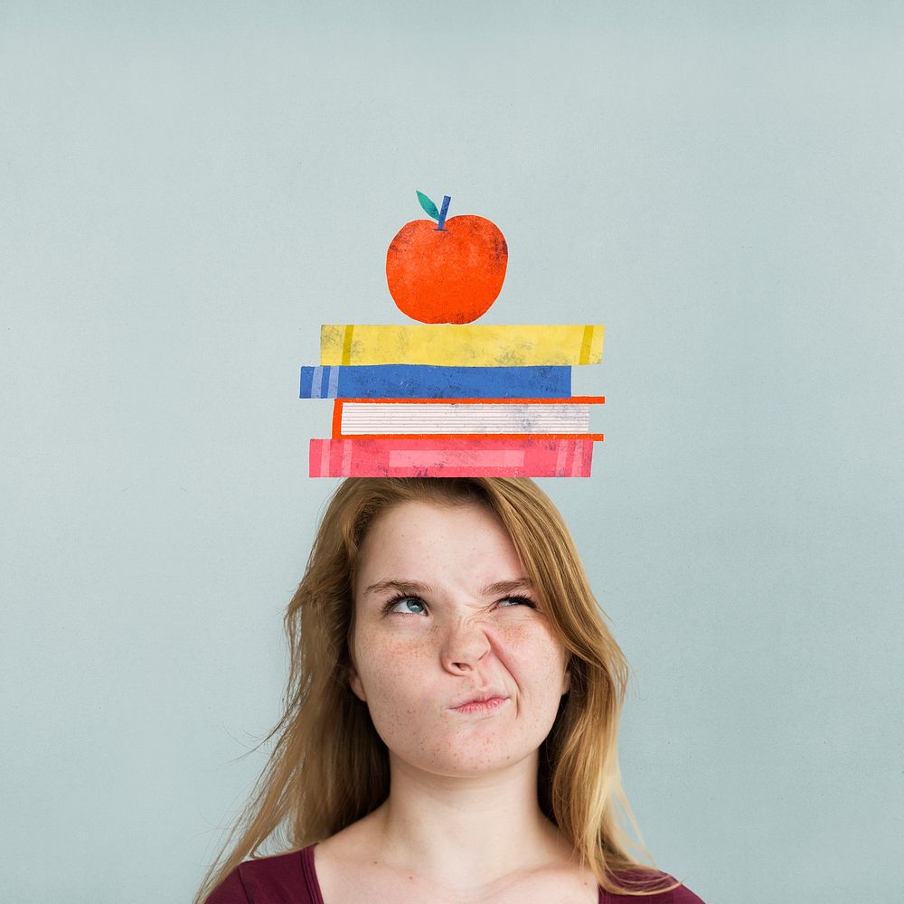 Student with book stack on her head