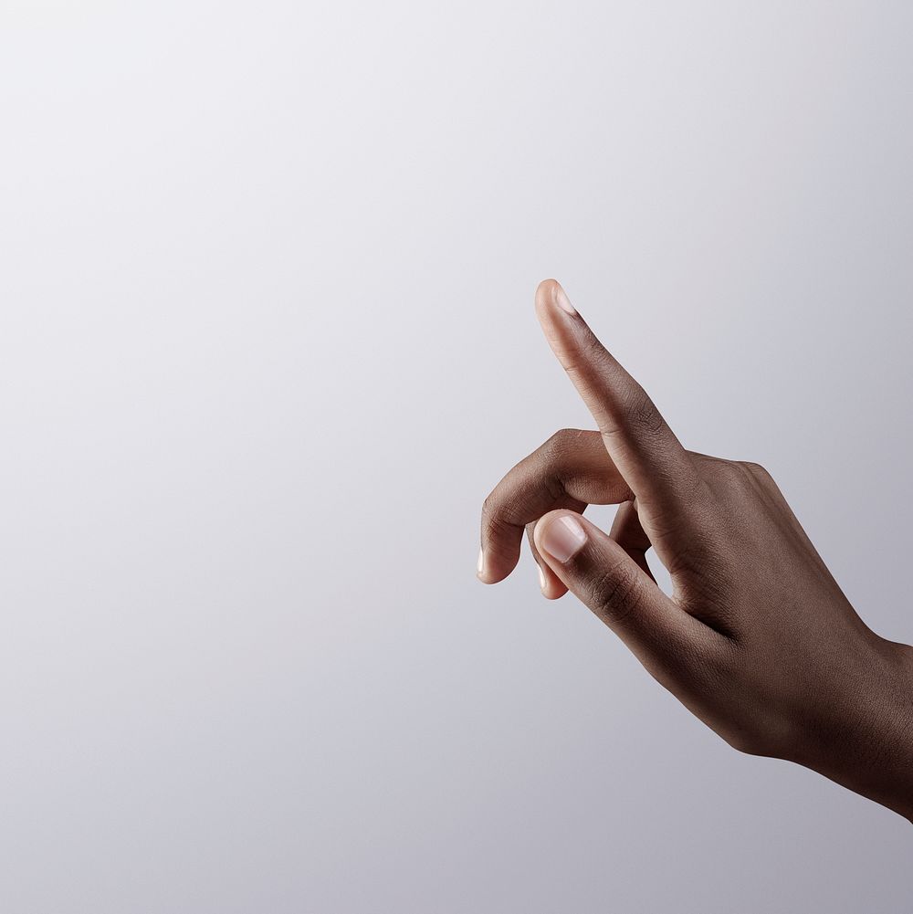 Woman&rsquo;s finger pointing on gray border background