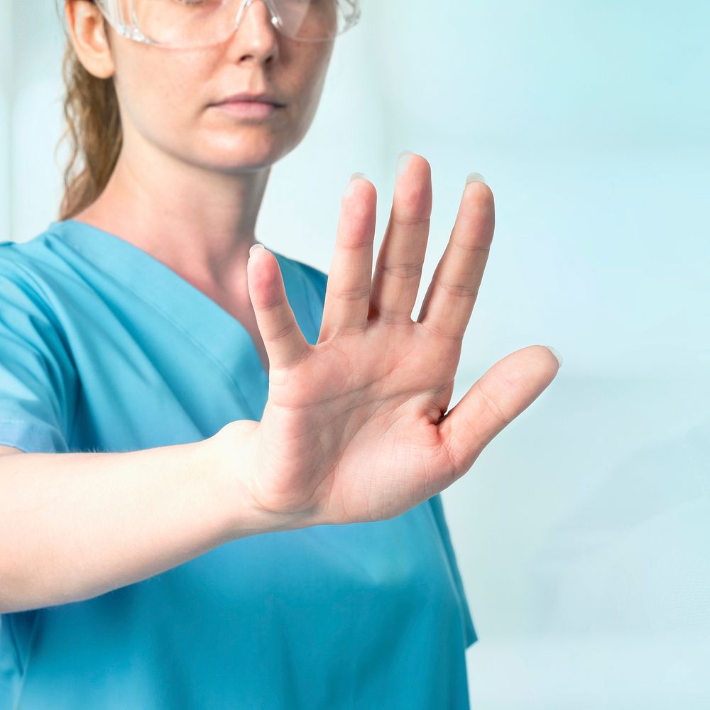 Female doctor  with smart glasses touching virtual screen medical technology