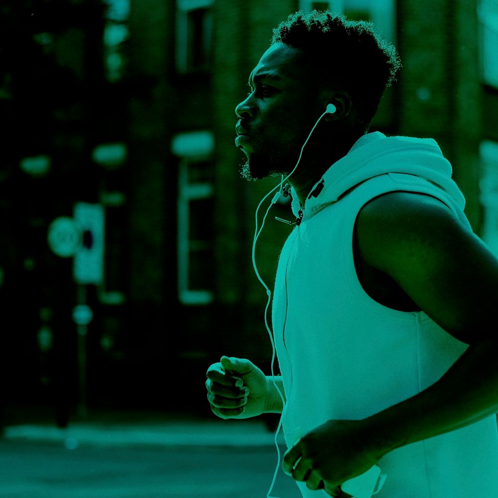 African American jogging while listening to music