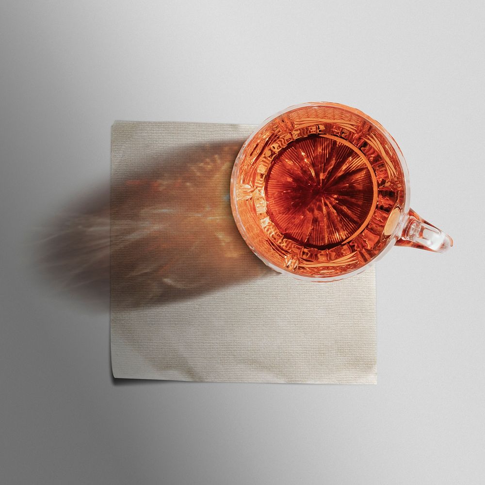 Paper napkin with whiskey glass on top