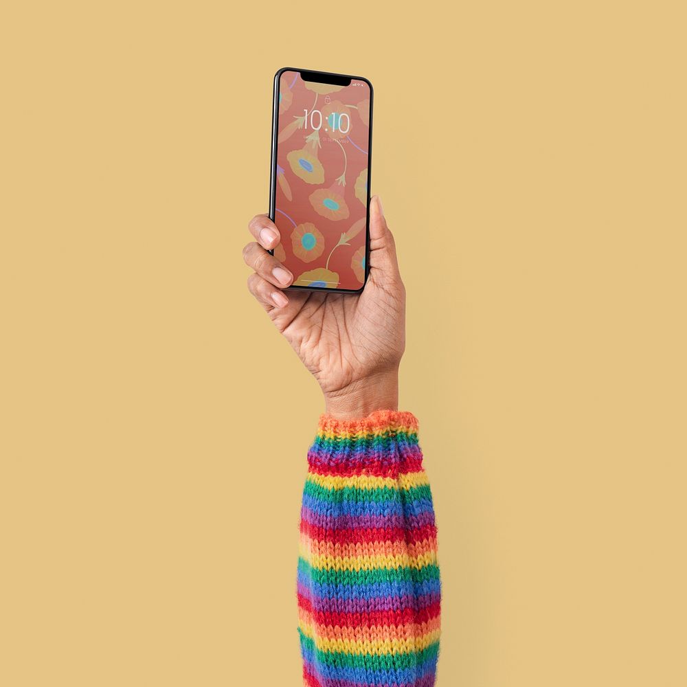 Smartphone isolated in studio with hand raised