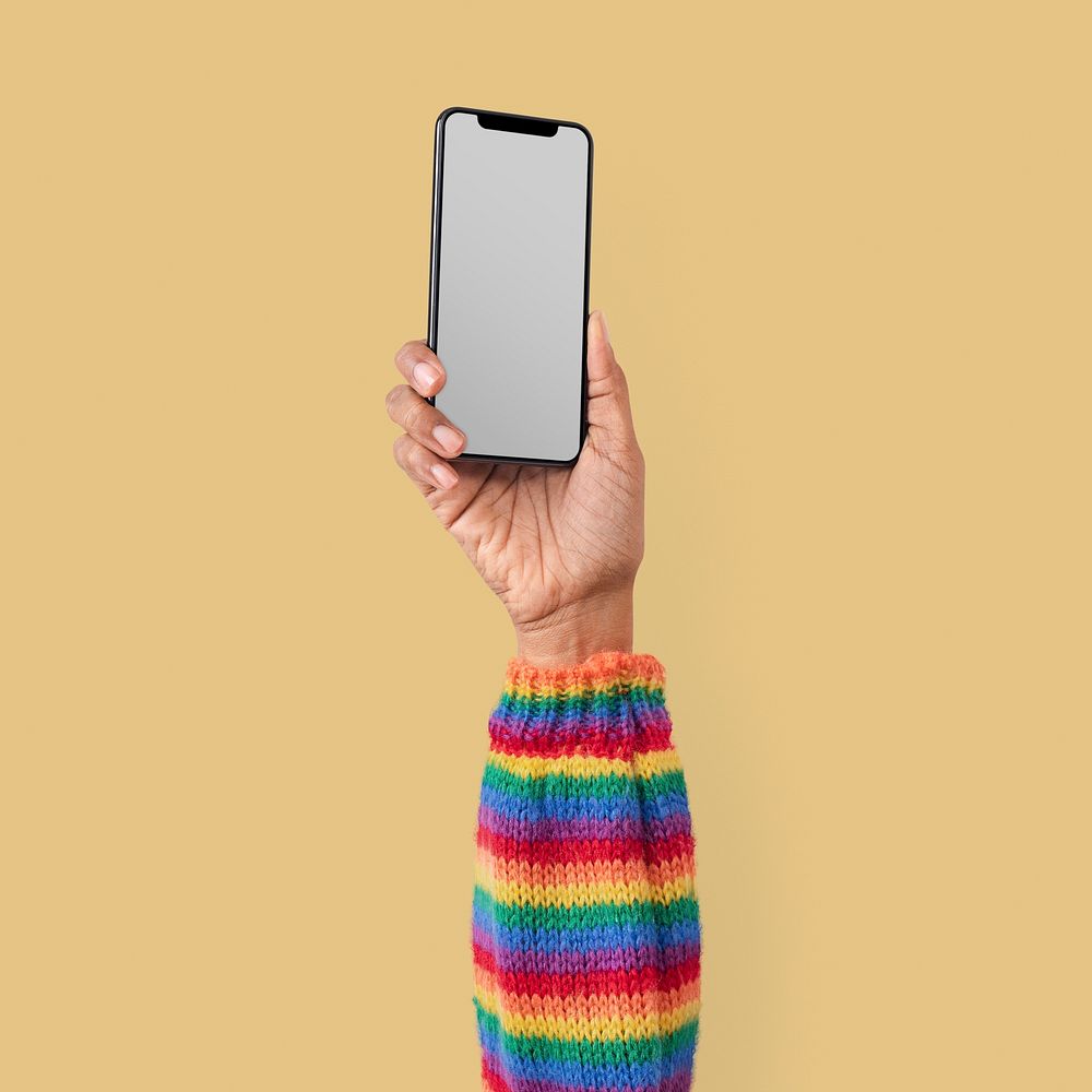 Blank smartphone screen isolated in studio with hand raised