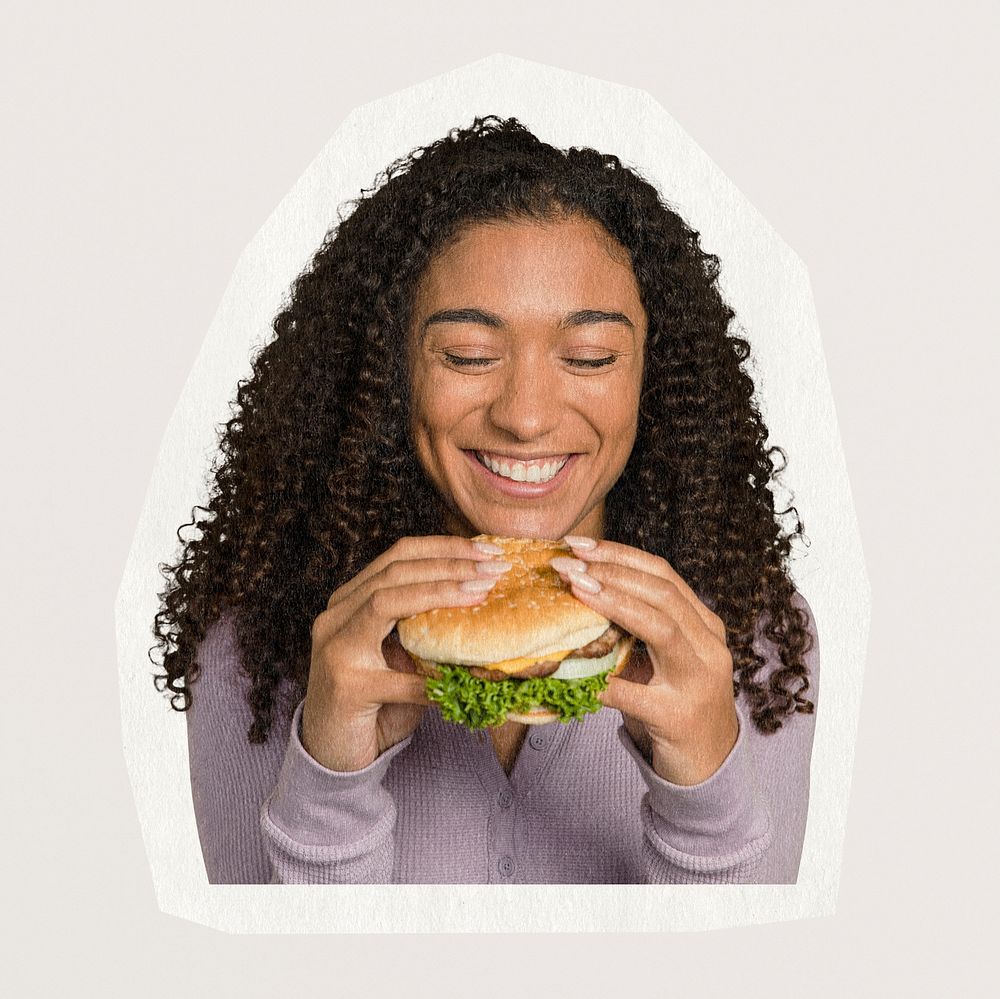 African American woman eating a hamburger