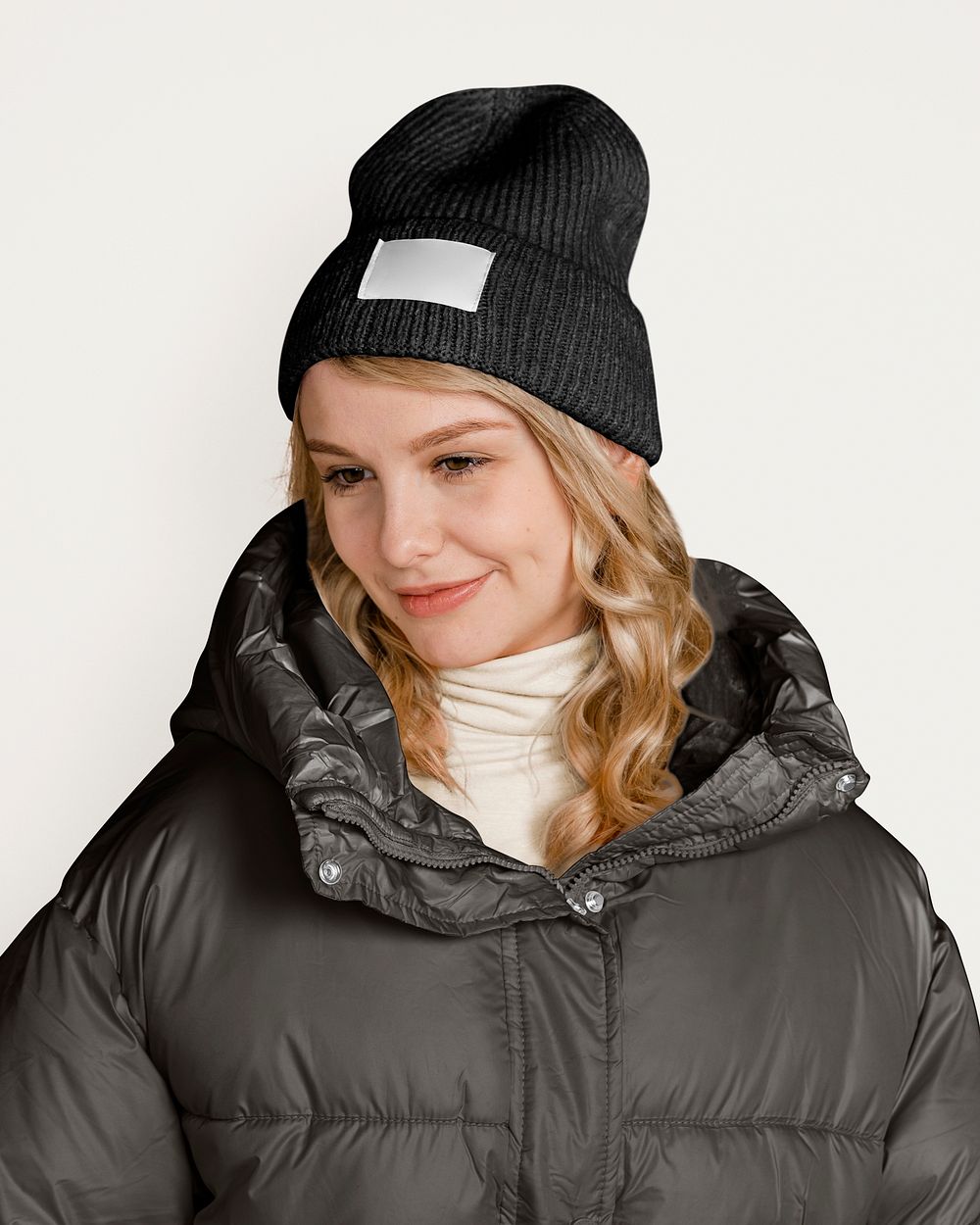 Woman in puffer jacket, isolated on off white