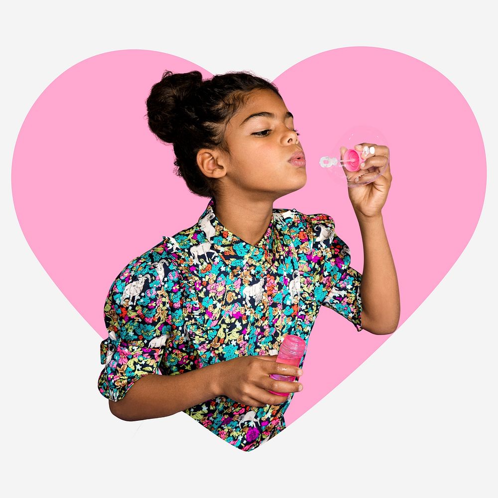 Girl blowing soap bubbles, pink heart shape badge
