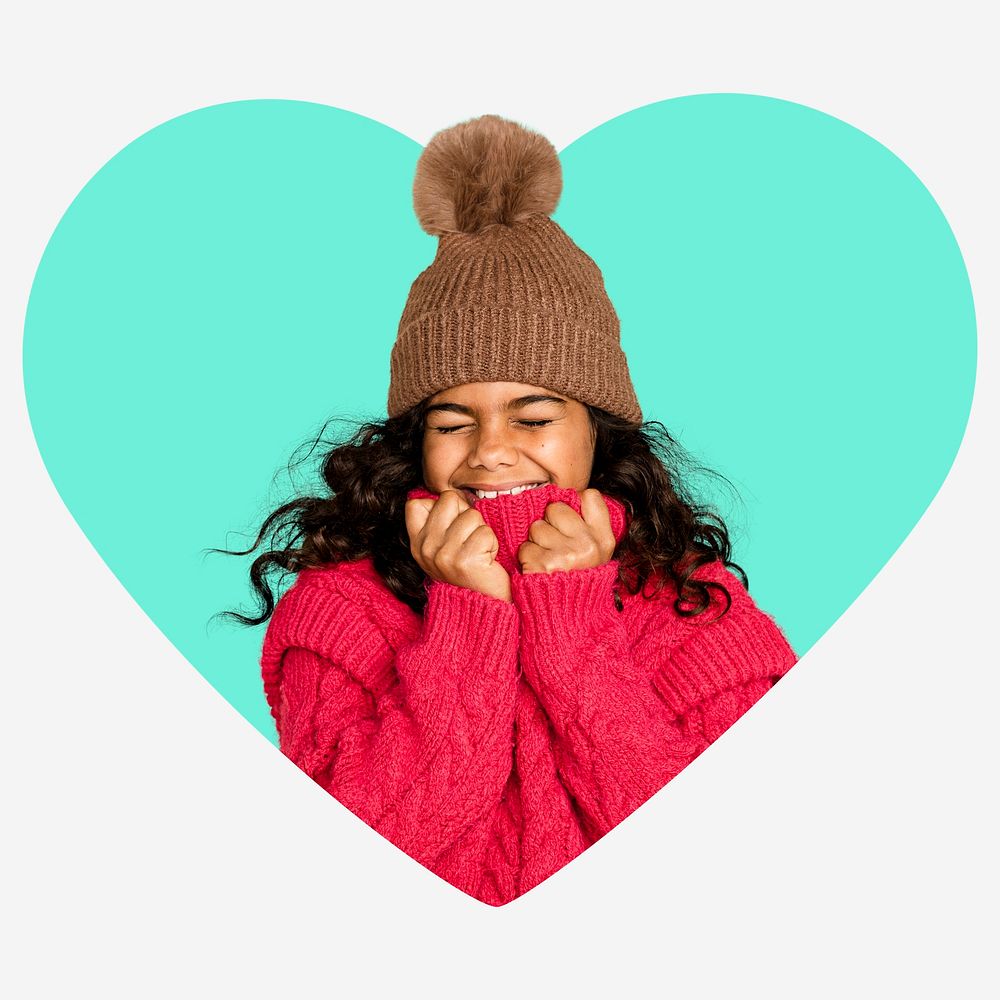 Cute little girl in winter clothes, heart shape badge