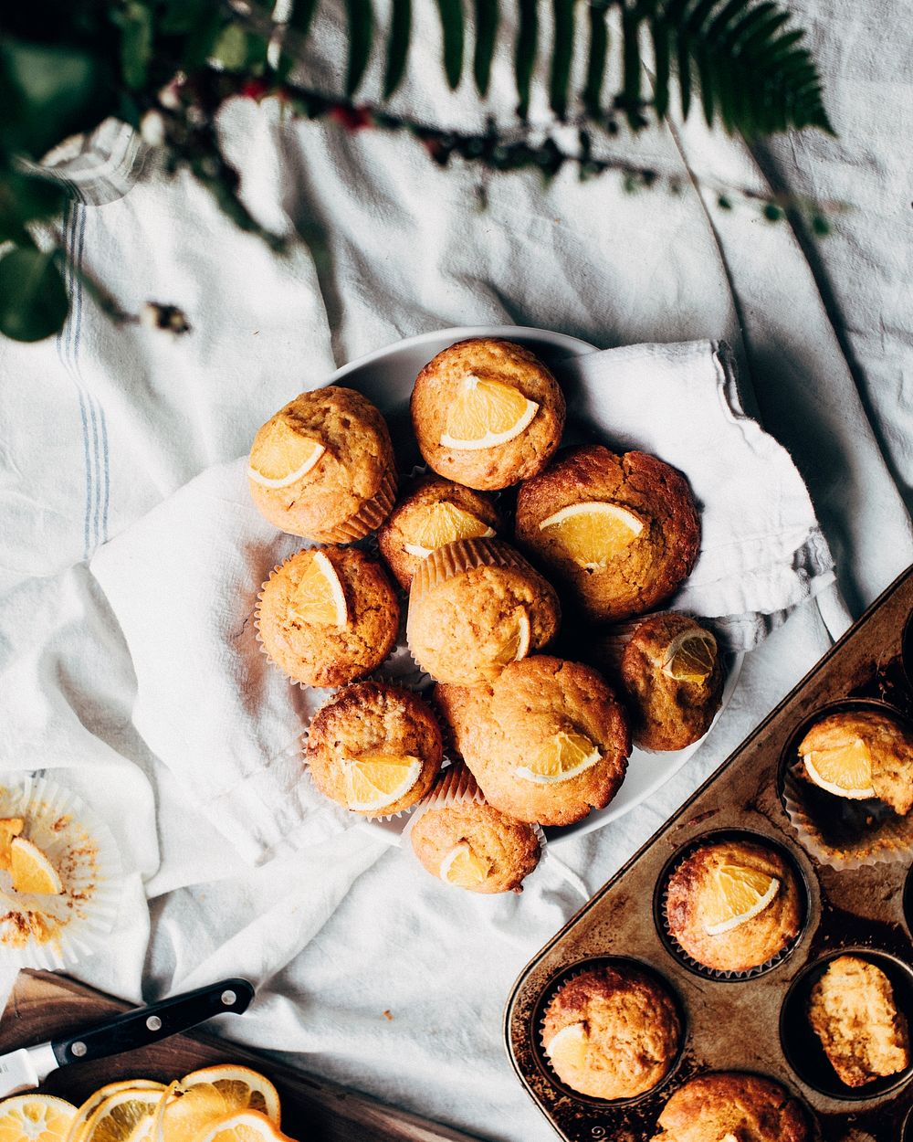 Basket of freshly baked orange muffins. Original public domain image from Wikimedia Commons