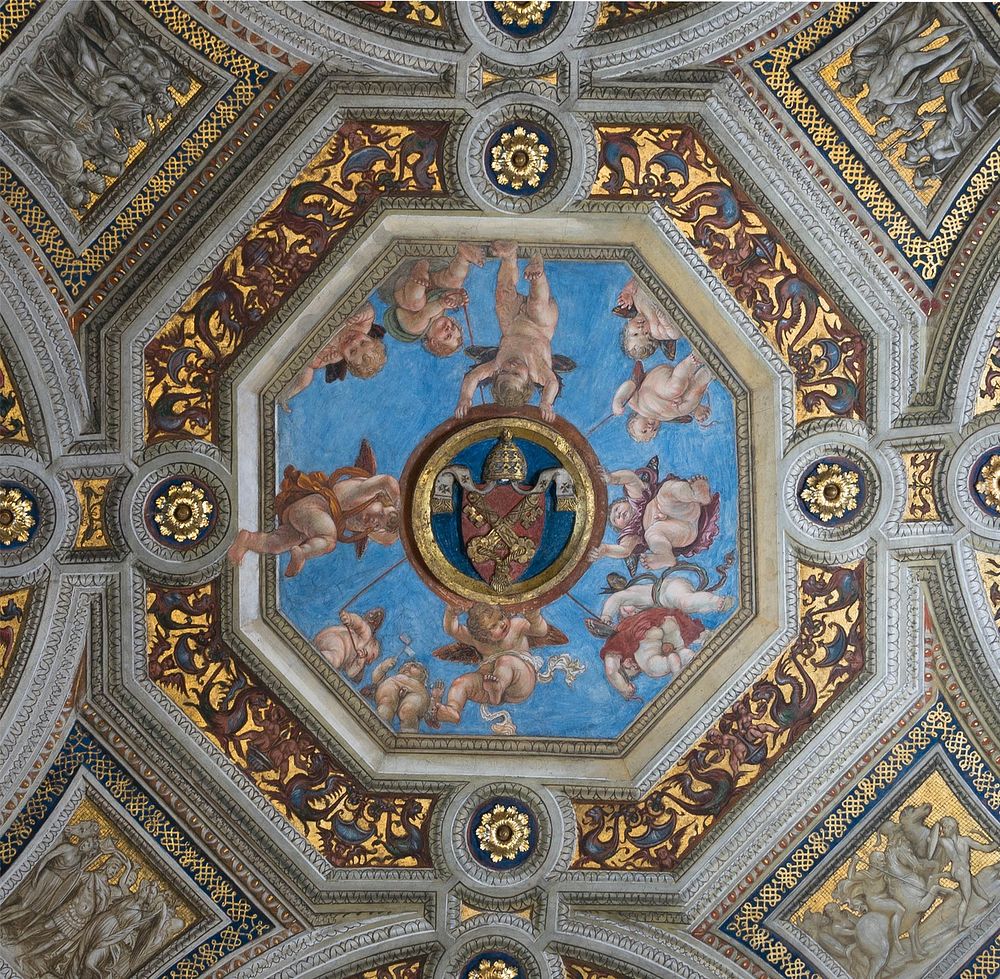 Ceiling of the Stanza della Segnatura in the Raphaëls rooms. Detail of the keystone, paintings by Raphaël. Vatican City.…