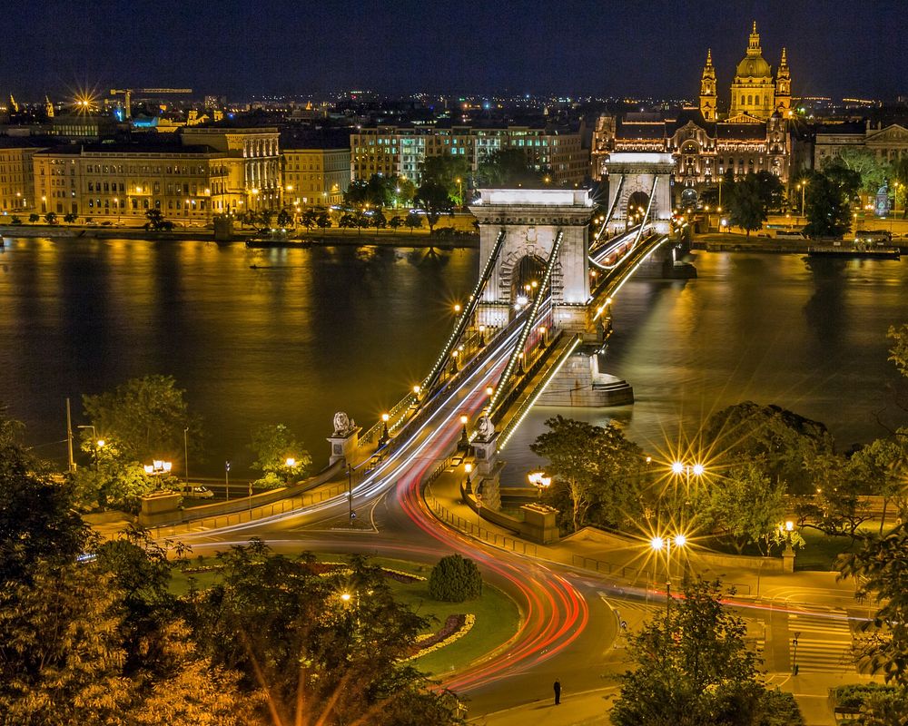 Sz&eacute;chenyi Chain Bridge in Budapest pictured at night. Original public domain image from Wikimedia Commons