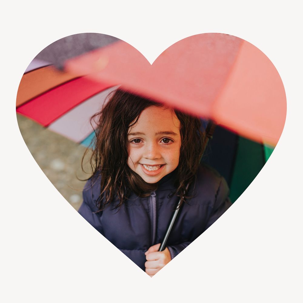 Little girl holding umbrella heart shape badge, rainy season photo