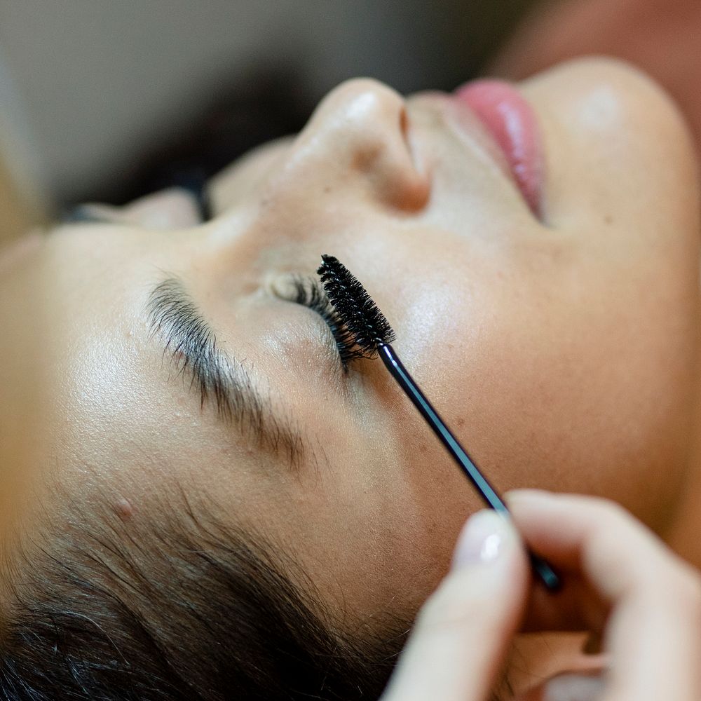 Customer getting eyelash treatment at a beauty salon