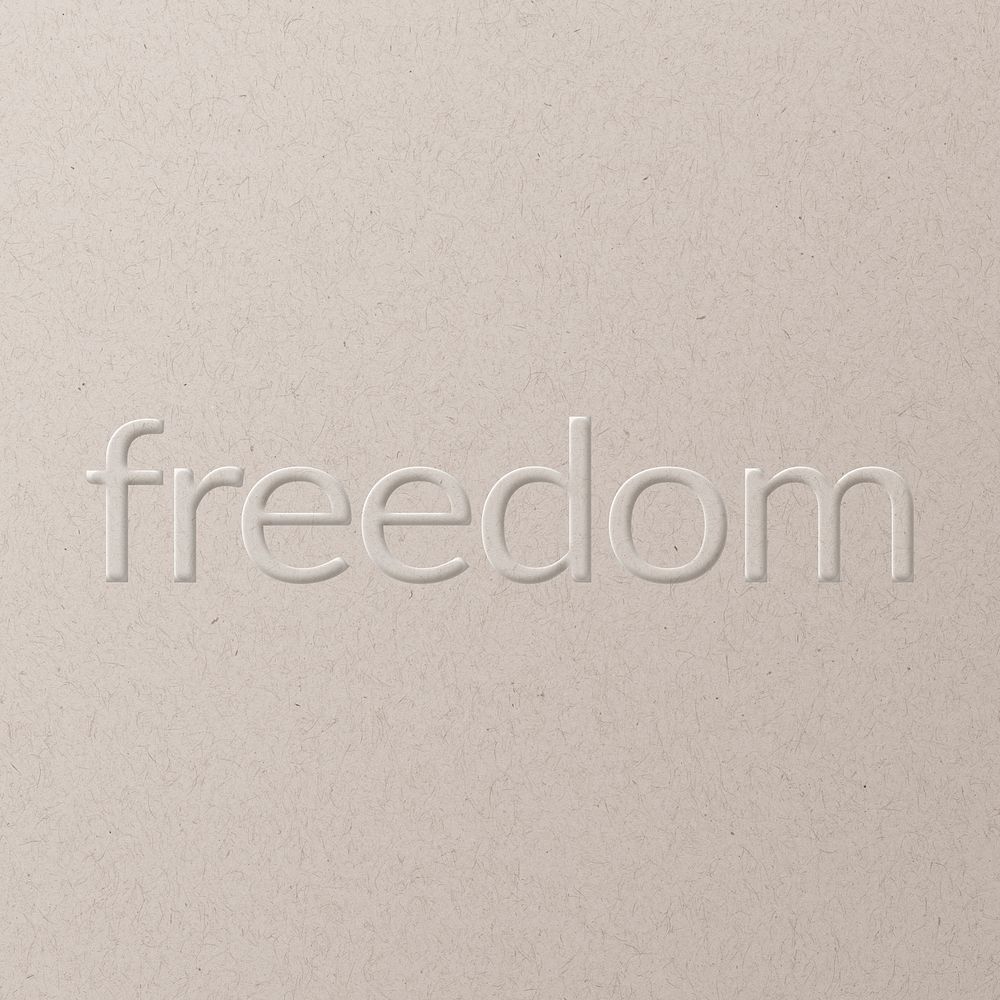 Freedom embossed text on white paper background
