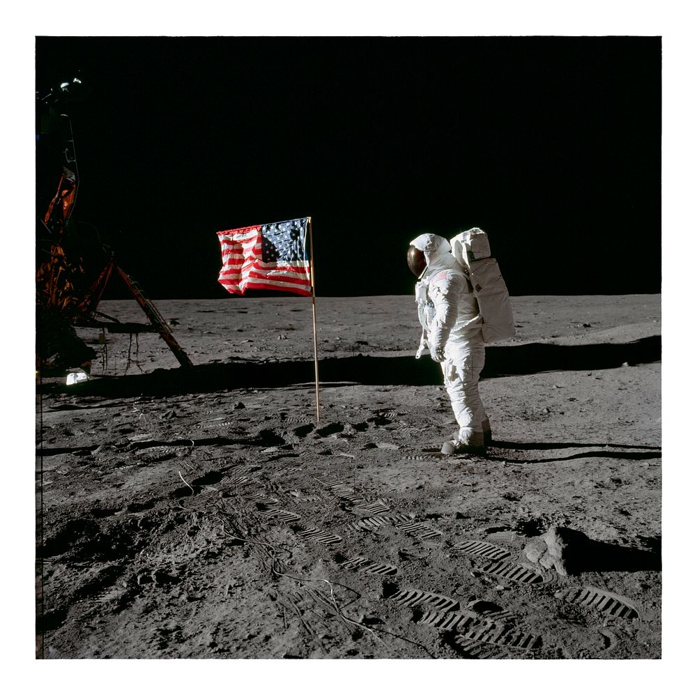 Moon landing vintage poster. Astronaut Edwin E. Aldrin Jr., beside the deployed United States flag during an Apollo 11…