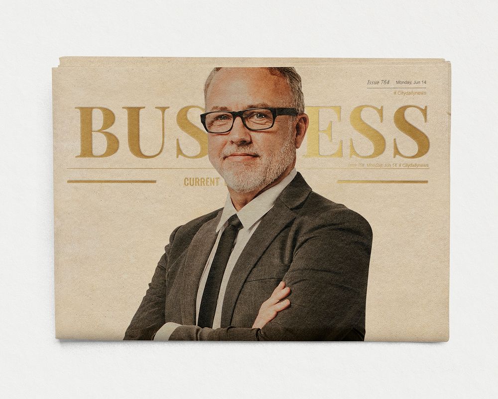 Corporate executive on newspaper, business headline