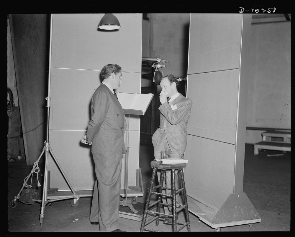 Spencer Tracy, narrator and Garson Kanin, director, at the Long Island Studios of the Army Signal Corps for the recording of…