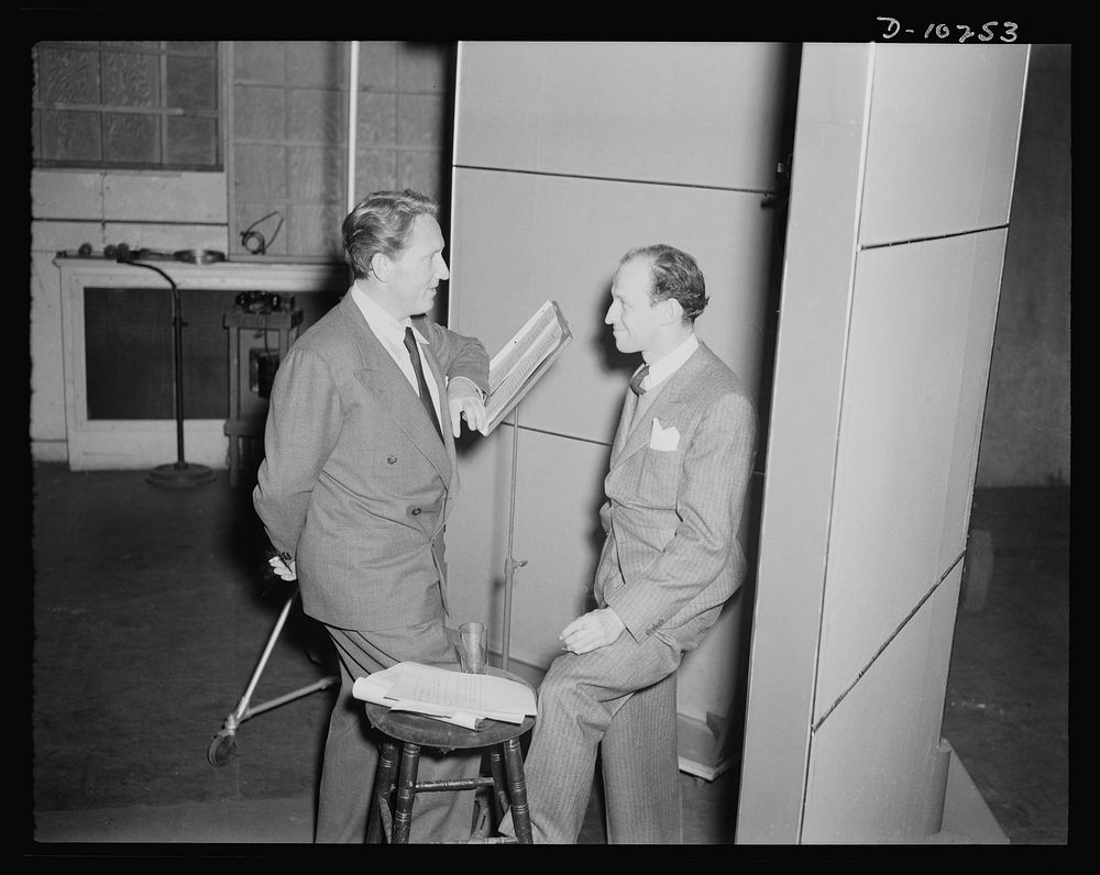 Spencer Tracy, narrator and Garson Kanin, director, at the Long Island Studios of the Army Signal Corps for the recording of…