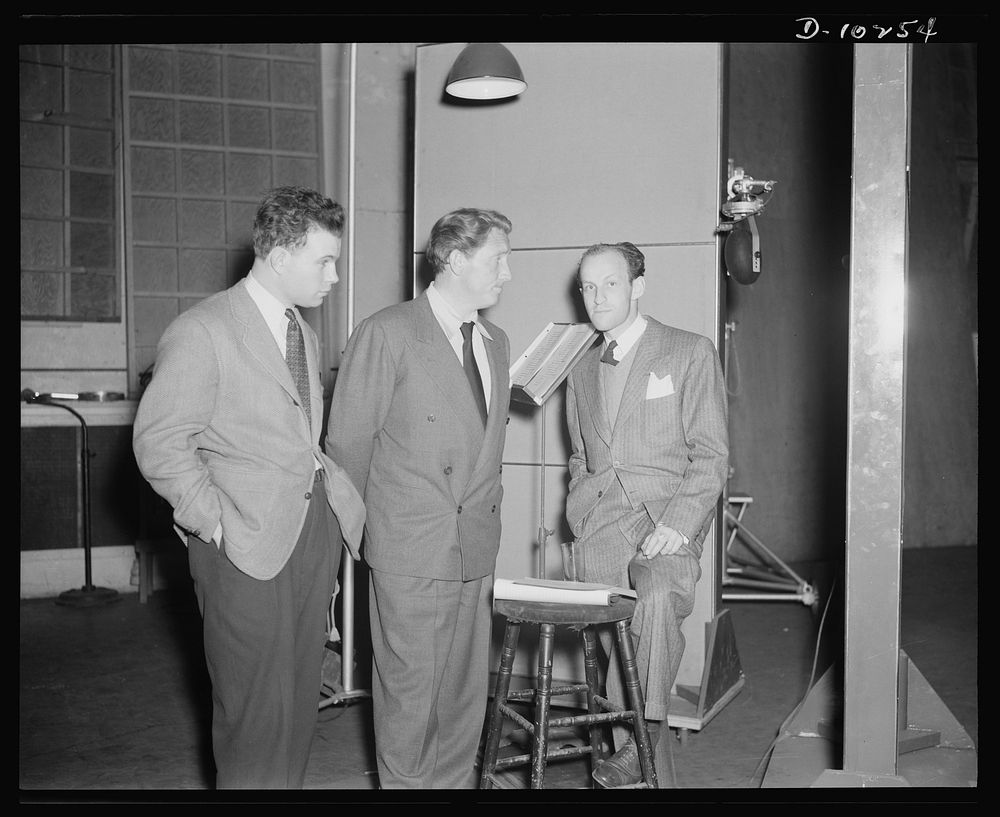 Philip Martin, Jr., technical director, Spencer Tracy, narrator and Garson Kanin, director, at the Long Island Studios of…