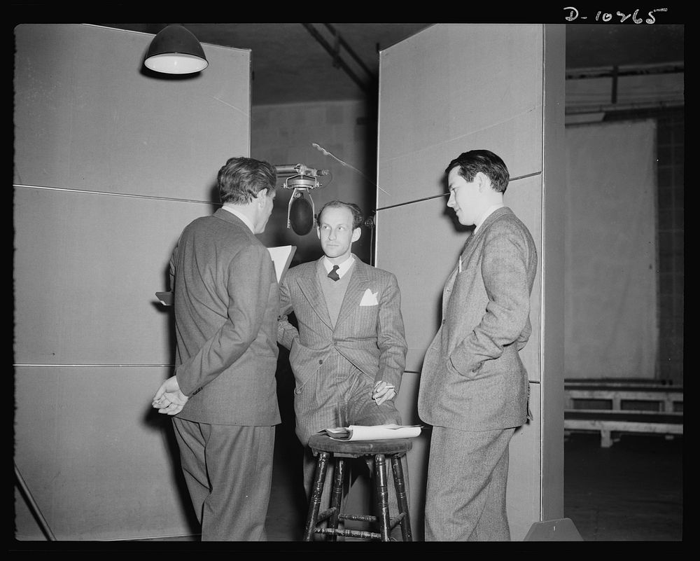 Spencer Tracy, narrator, Garson Kanin, director, Wallace Russell, writer, at the Long Island Studios of the Army Signal…