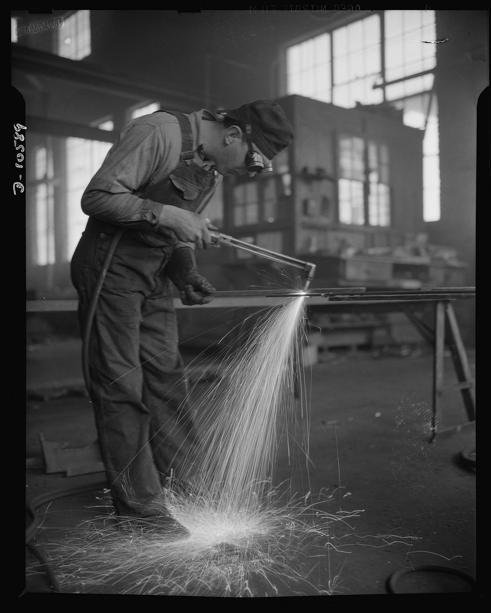 Denver, Colorado. Twenty-four hours a day the sparks from acetylene torches of steel workers in eight Denver fabricating…