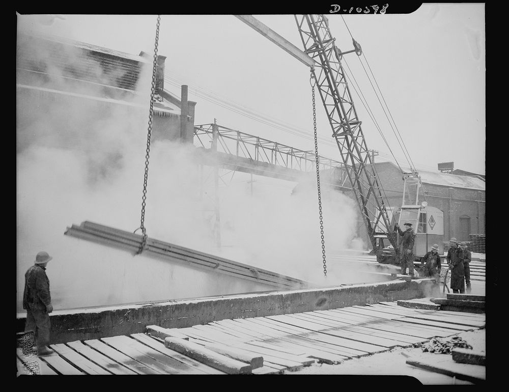 Denver, Colorado. Steel ship parts getting a bath of sulphuric acid at one of the eight Denver plants which prepares the…