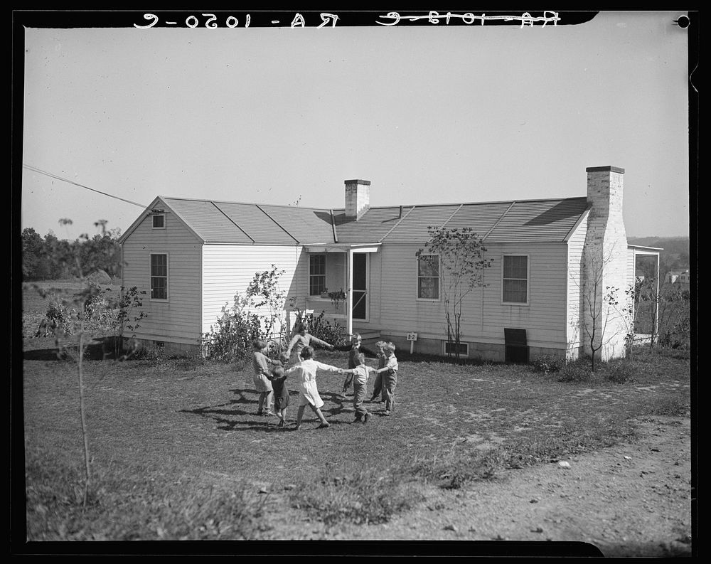 Children front their new home. Free Photo rawpixel