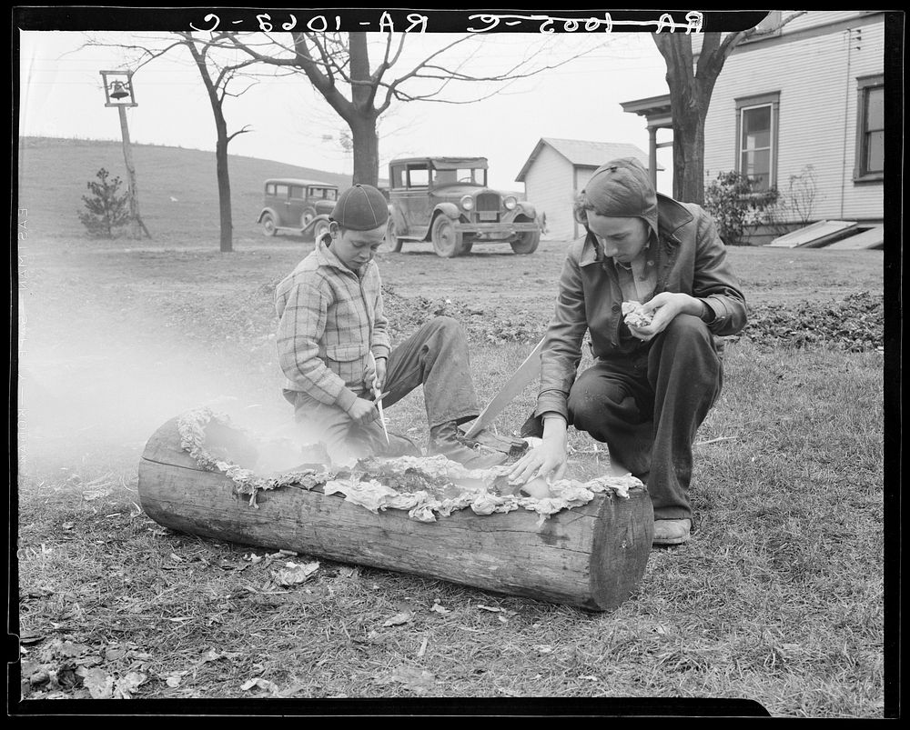 Boys smoking log. Reedsville, West Virginia. Sourced from the Library of Congress.