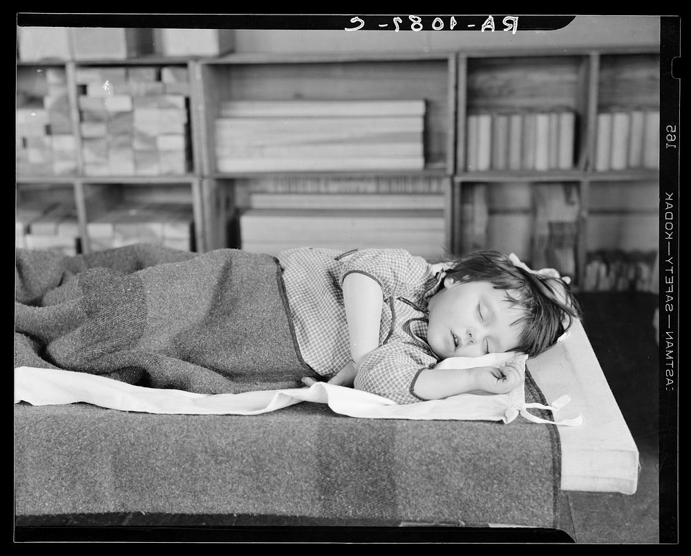 Child sleeping in nursery school. Reedsville, West Virginia. Sourced from the Library of Congress.