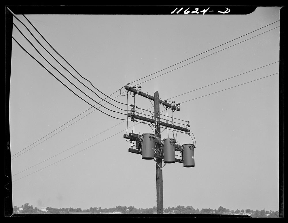 Washington, D.C. Service pole with three transformers hanging from cross arm in Congress Heights, S.E.. Sourced from the…