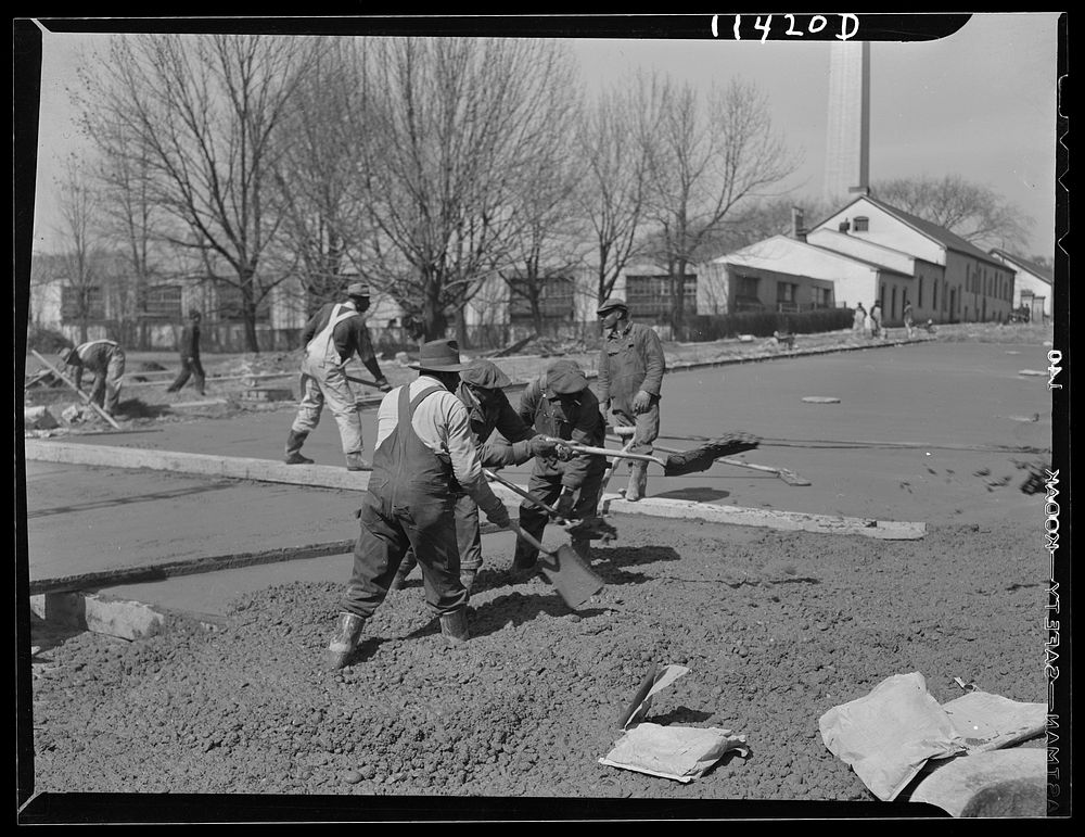 Washington, D.C. Construction of a bridge and road near Independence Avenue and 14th and 16th Streets, S.W.  Men shoveling…