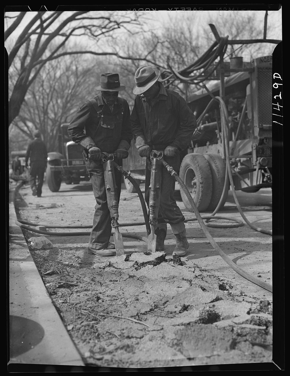 Washington, D.C. Construction of a bridge and road near Independence Avenue and 14th and 16th Streets, S.W. Men breaking old…