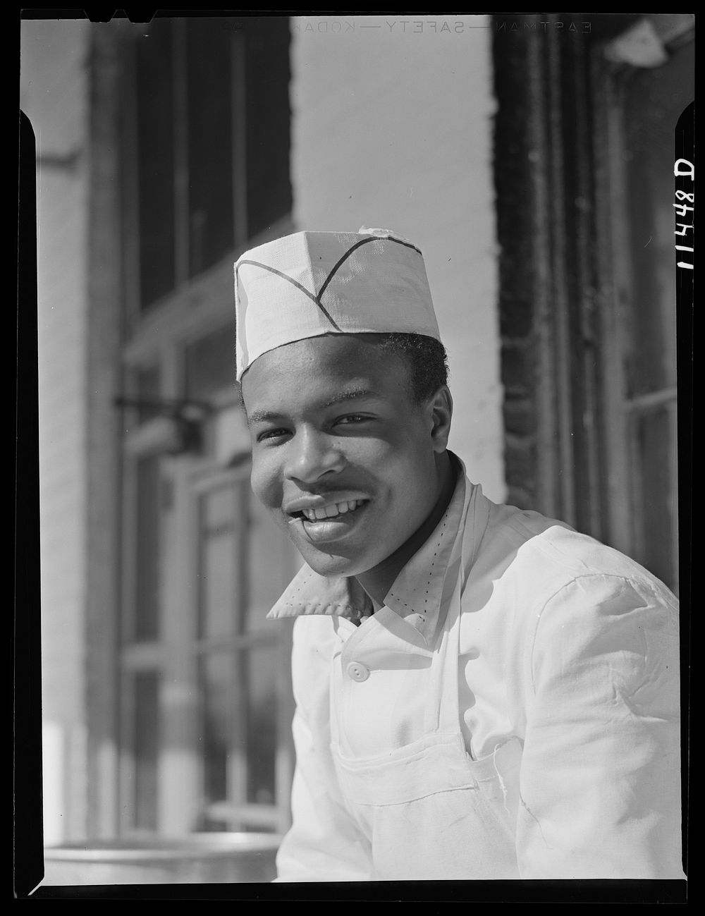 Washington, D.C. Cook who works in one of the seafood restaurants in the fish market district. Sourced from the Library of…