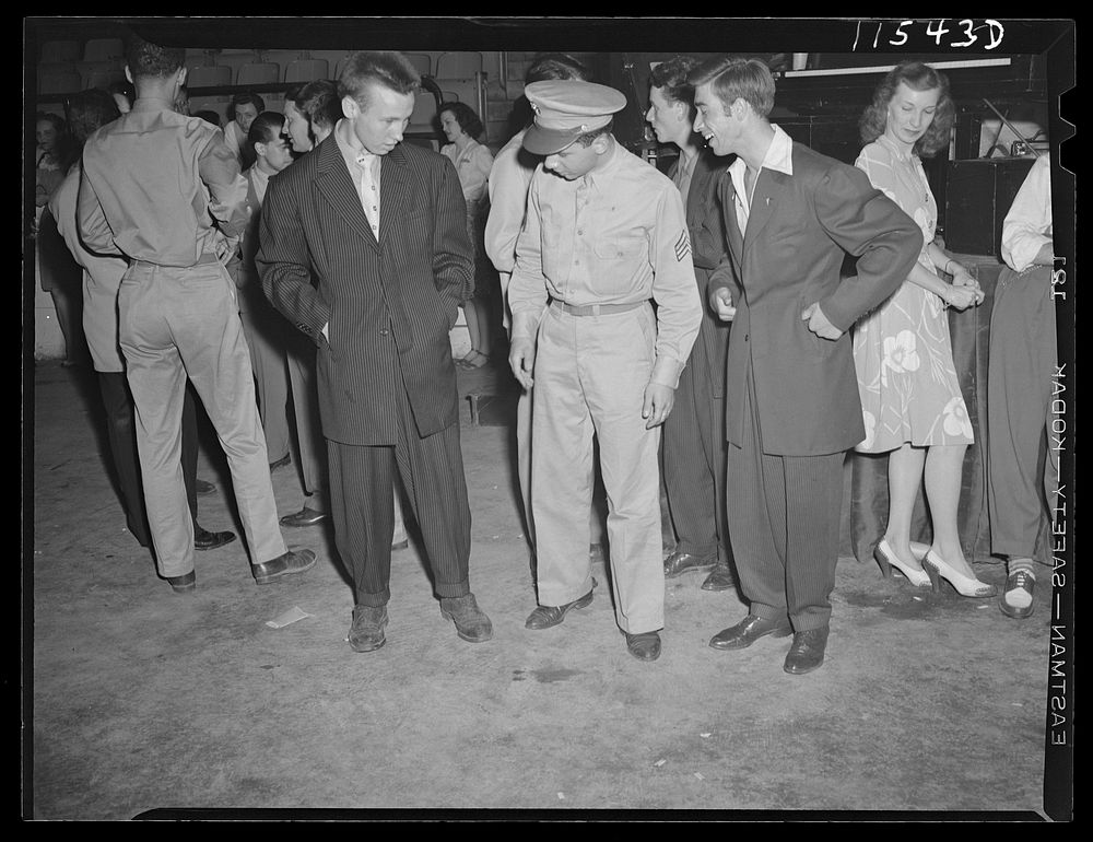 Washington, D.C. Soldier inspecting a couple of "zoot suits" at the Uline Arena during Woody Herman's Orchestra engagement…