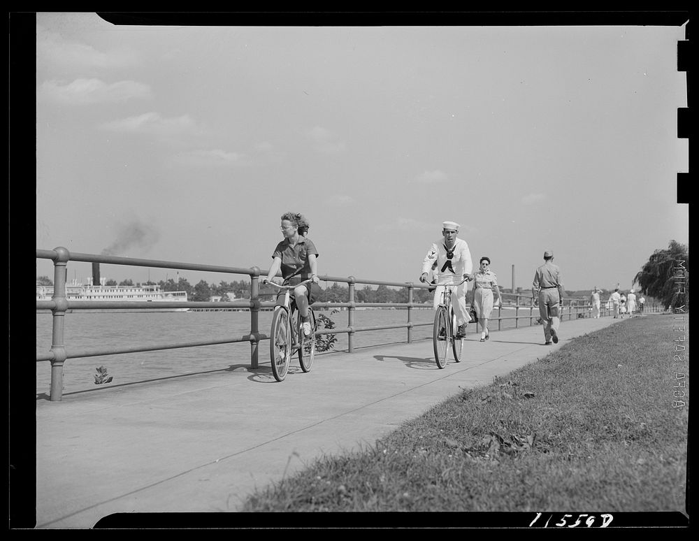 Washington, D.C. Sailor and girl bicycling at Hains Point. Sourced from the Library of Congress.