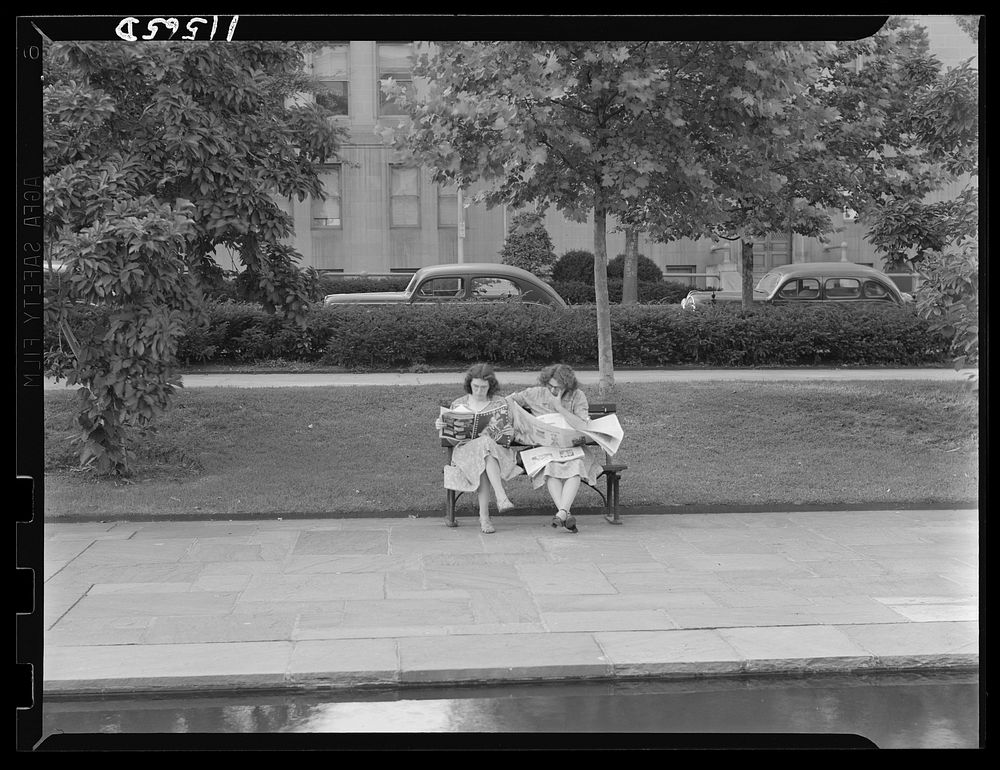 Washington, D.C. Rawlins Park, at 18th and E Streets, N.W. Government employees reading papers. Sourced from the Library of…