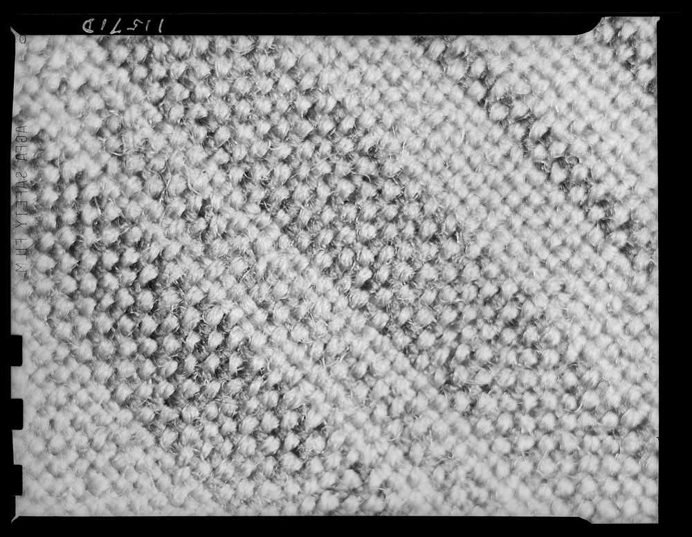 Texture background for motion picture and filmstrip titles. Wool fabric tweed detail. Sourced from the Library of Congress.