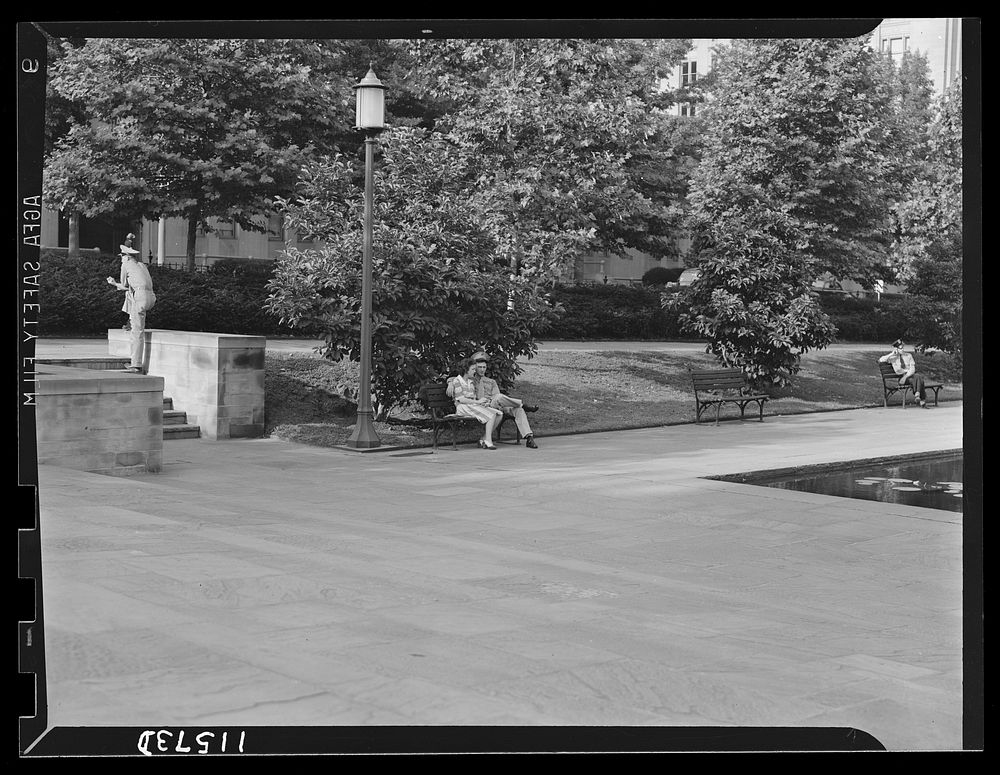 Washington, D.C. Rawlins Park. U.S. marine and his girl sitting on a bench. Sourced from the Library of Congress.
