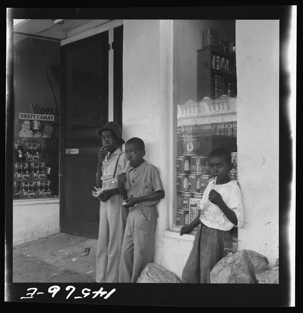  boys eating popsicles. At Starke, Florida. Sourced from the Library of Congress.