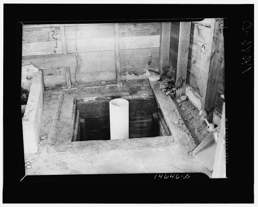 Milaca, Minnesota. Well pit eliminated by installation of pipe and water pump. Sourced from the Library of Congress.