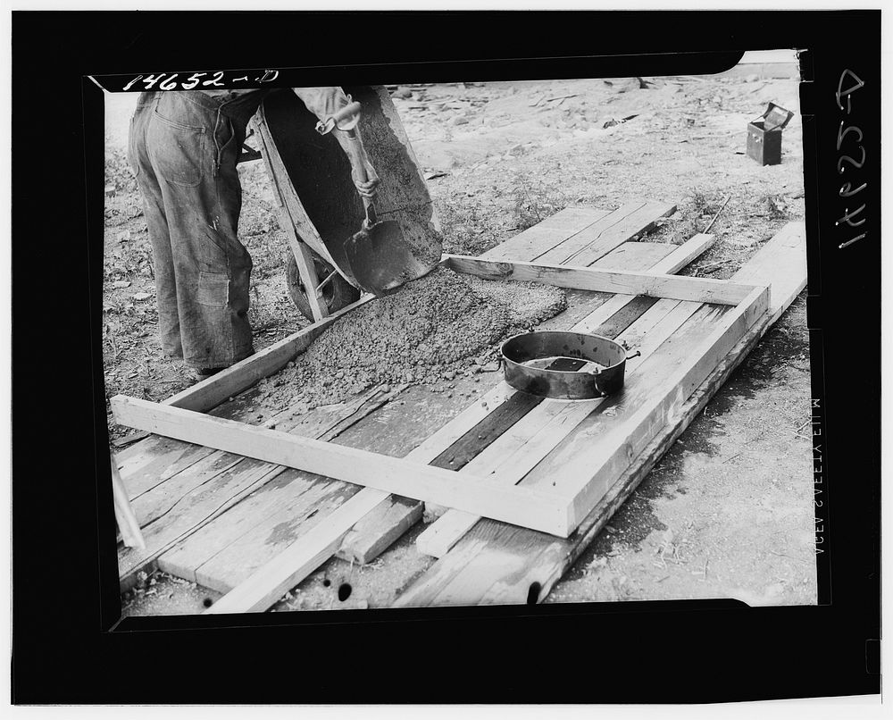Collar for cast iron stool placed in form for sanitary privy slab. Minnesota. Sourced from the Library of Congress.